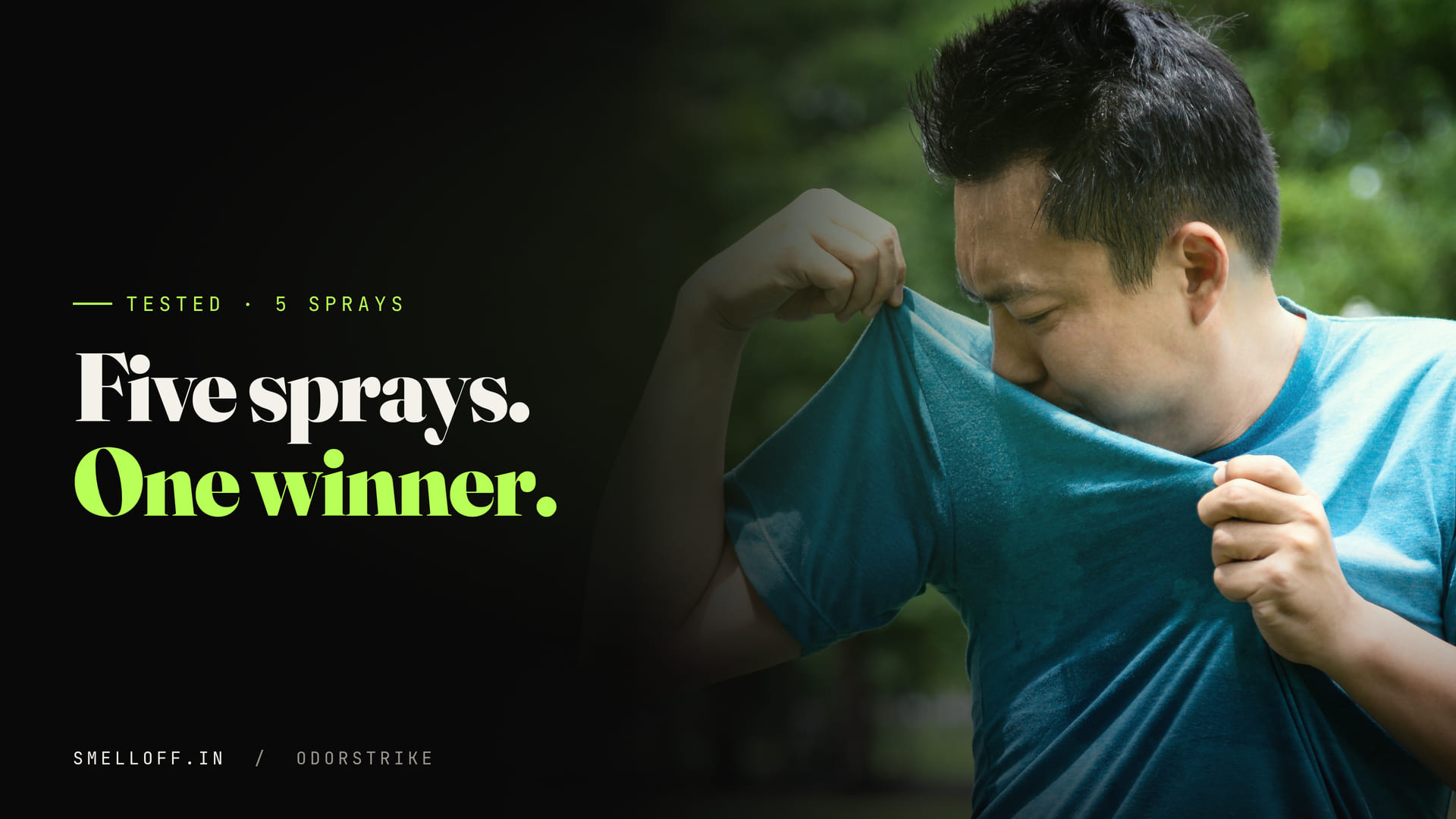 A man pulls his t-shirt up to his face to smell the fabric, checking the shirt rather than his skin