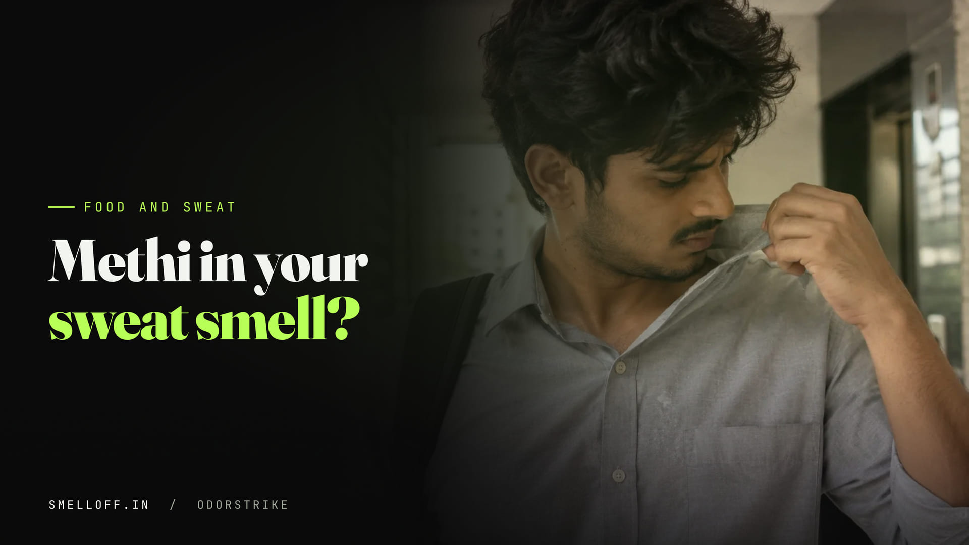 A man checks how the collar of his shirt smells