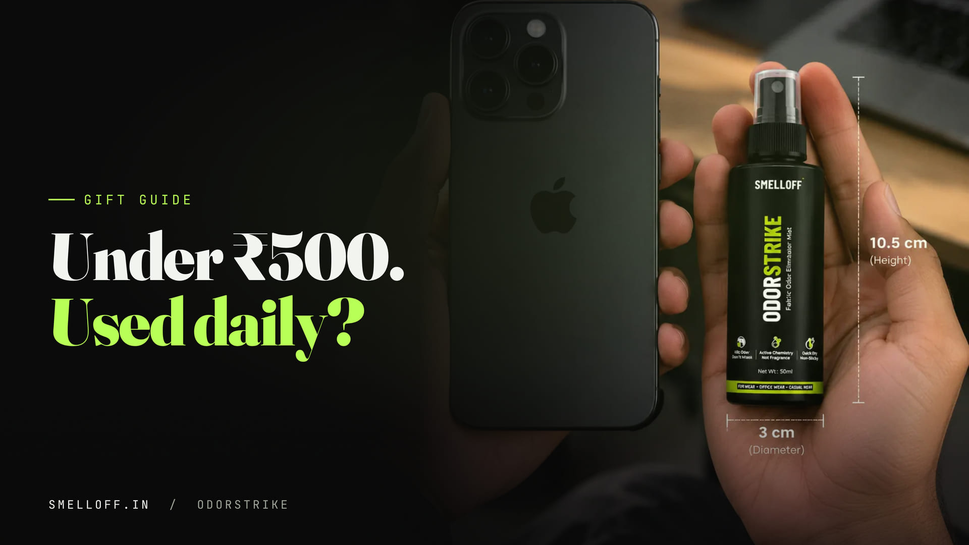 A hand holds the small ODORSTRIKE bottle next to a smartphone to show its pocket size