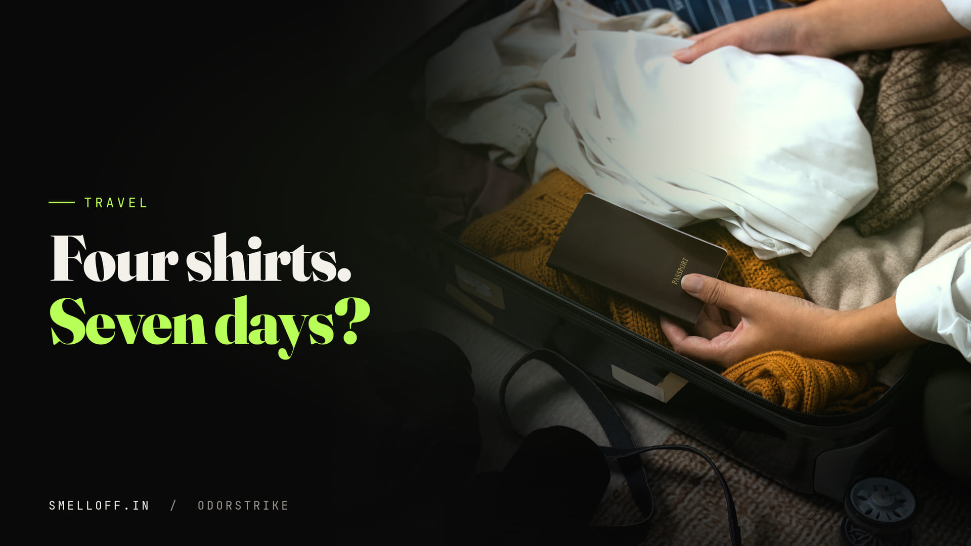 A traveller packs folded shirts and knitwear into an open suitcase before a trip