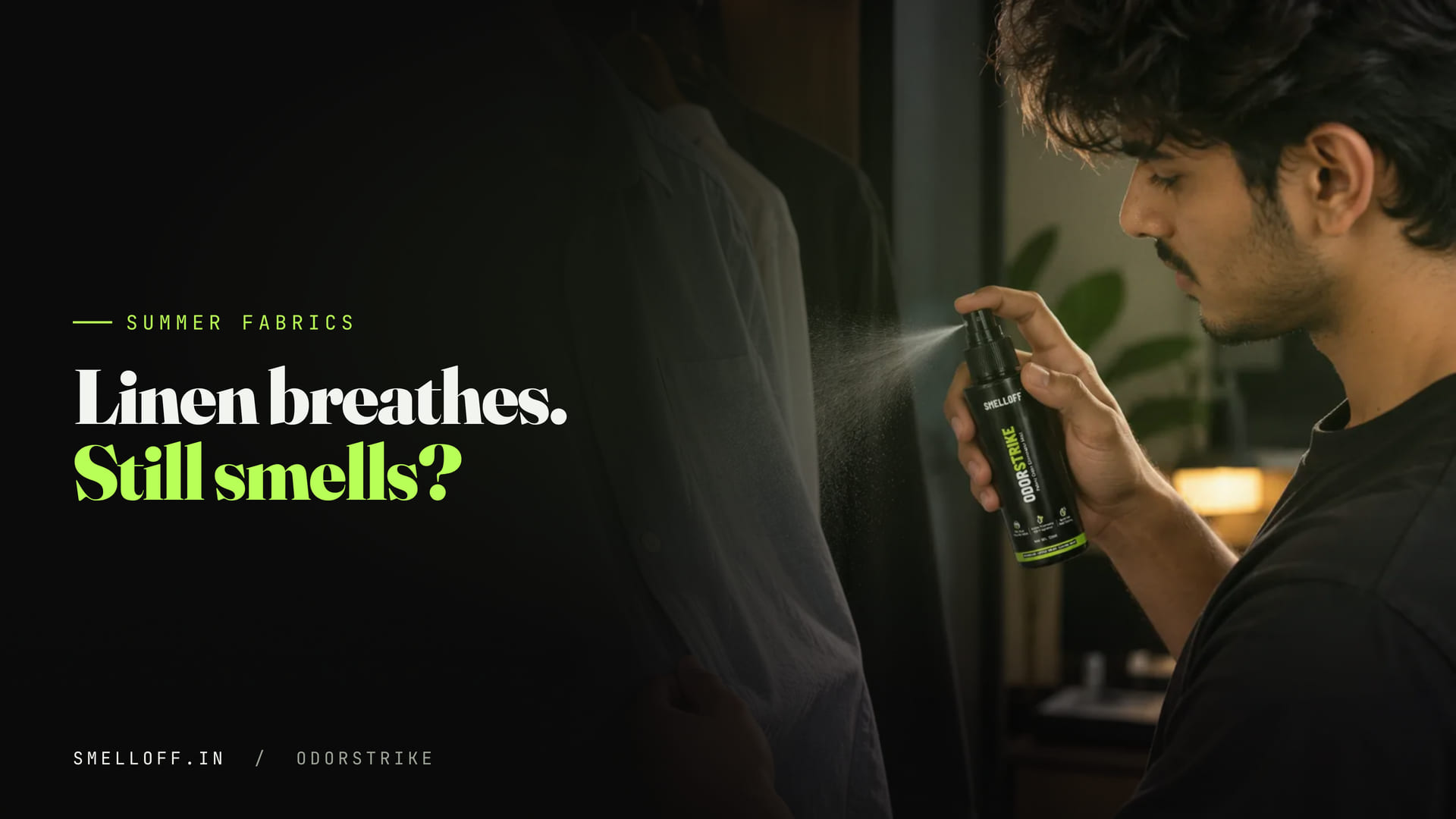 A fine mist from the ODORSTRIKE bottle lands on the fabric of a shirt