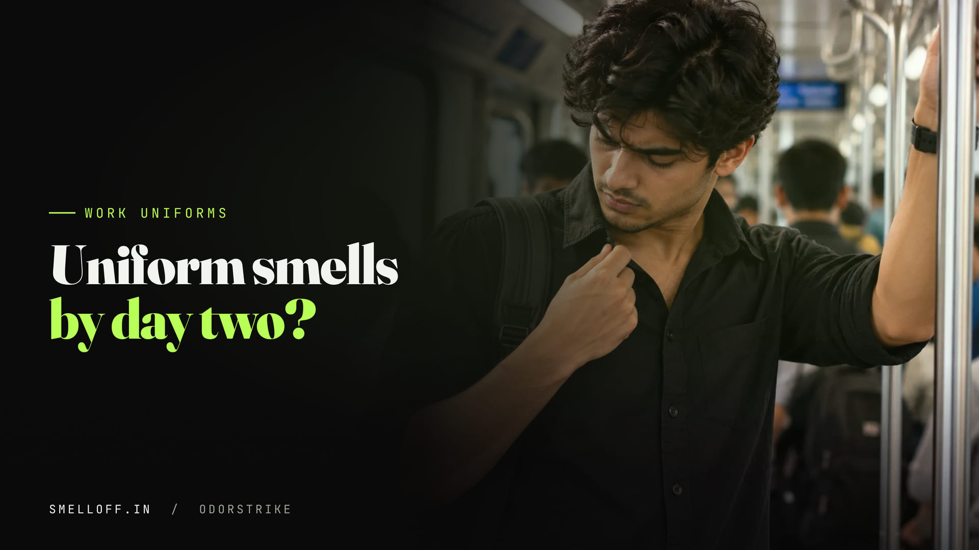 A commuter on a crowded metro tugs at his black shirt collar and checks how it smells