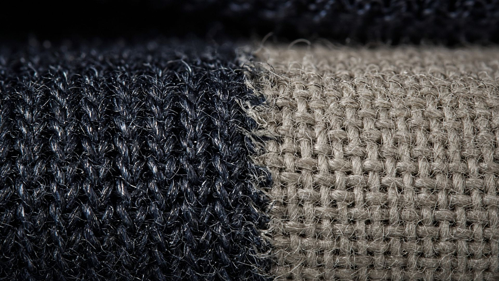 Macro of polyester knit fibres with an oily sheen next to a more matte cotton weave