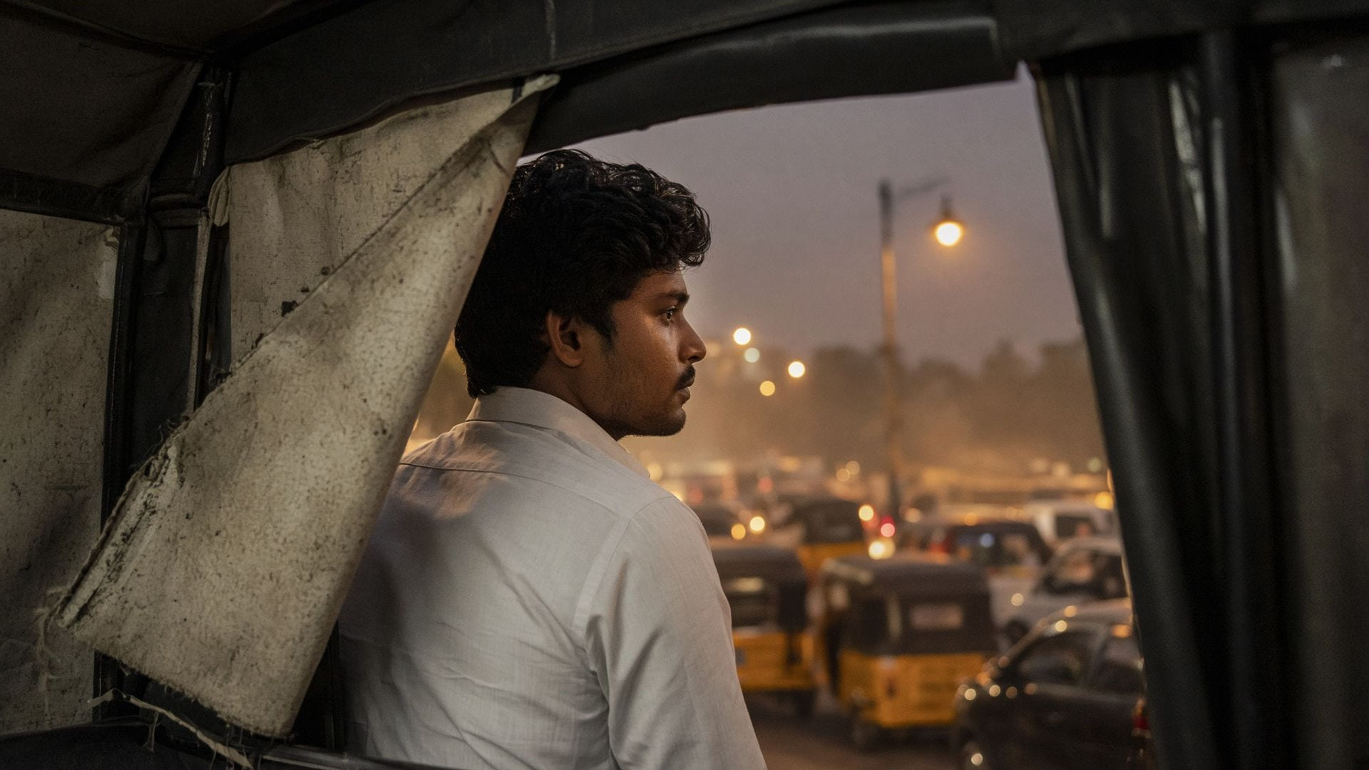 A formal shirt catching dust and exhaust haze inside an auto-rickshaw in Indian city traffic